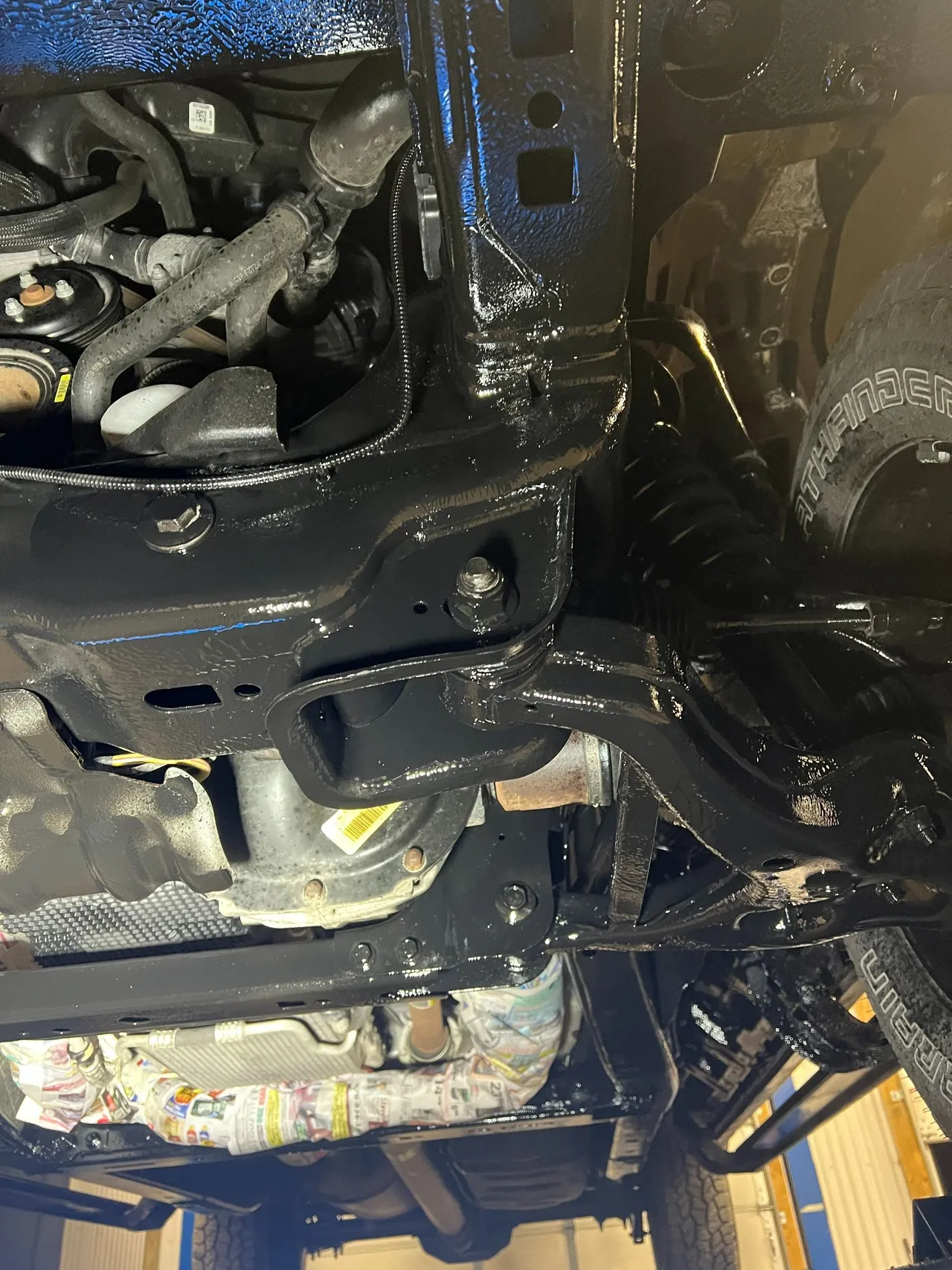 Freshly coated truck frame and suspension components after undercoating