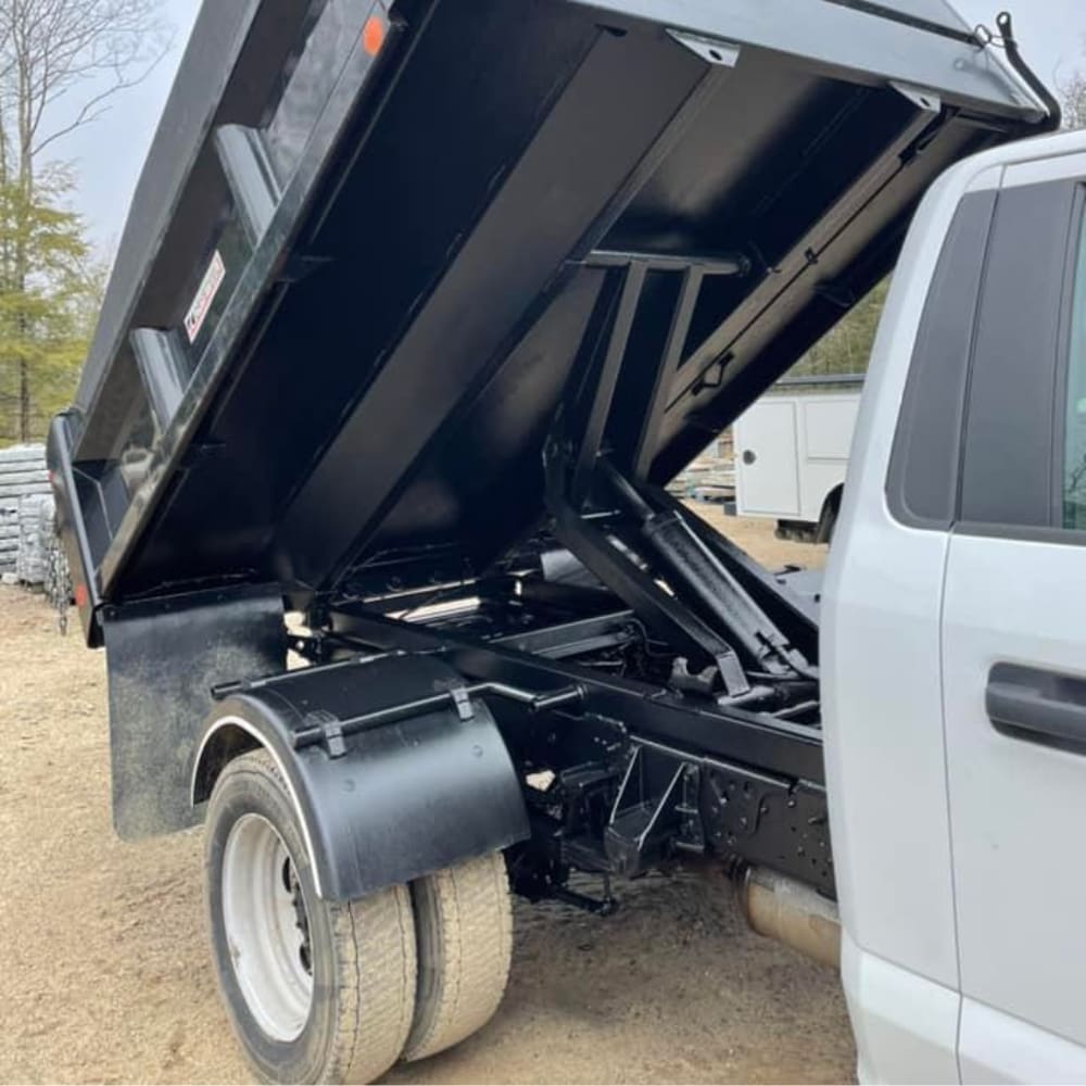 Dump truck body and underbody frame protected with rust-preventive coating