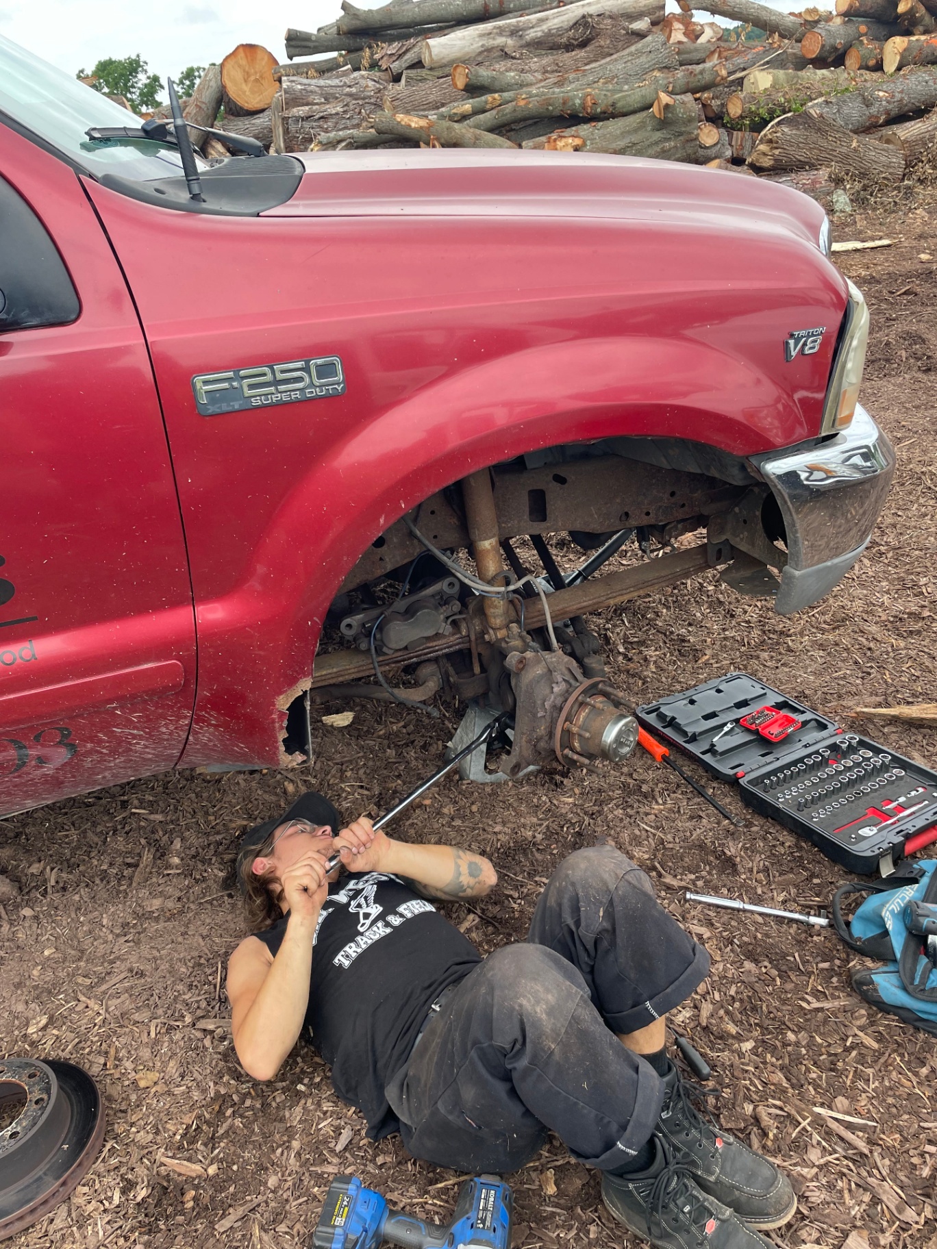 G23 Solutions technician performing an on-site front axle repair on a Ford F-250 Super Duty